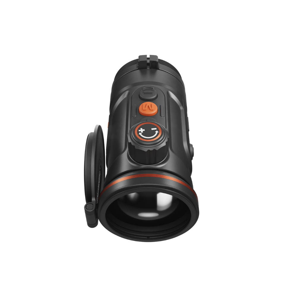 A black thermal scope with orange accents, featuring a textured adjustment knob, and a mounted base.