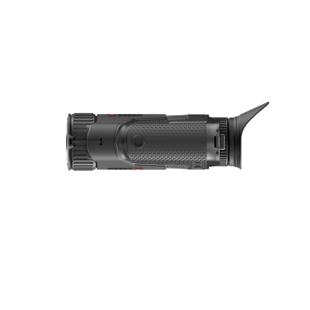 A black tactical monocular or scope photographed from the side.