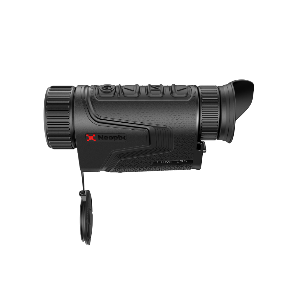 A thermal monocular rifle scope with its protective cap hanging from a lanyard