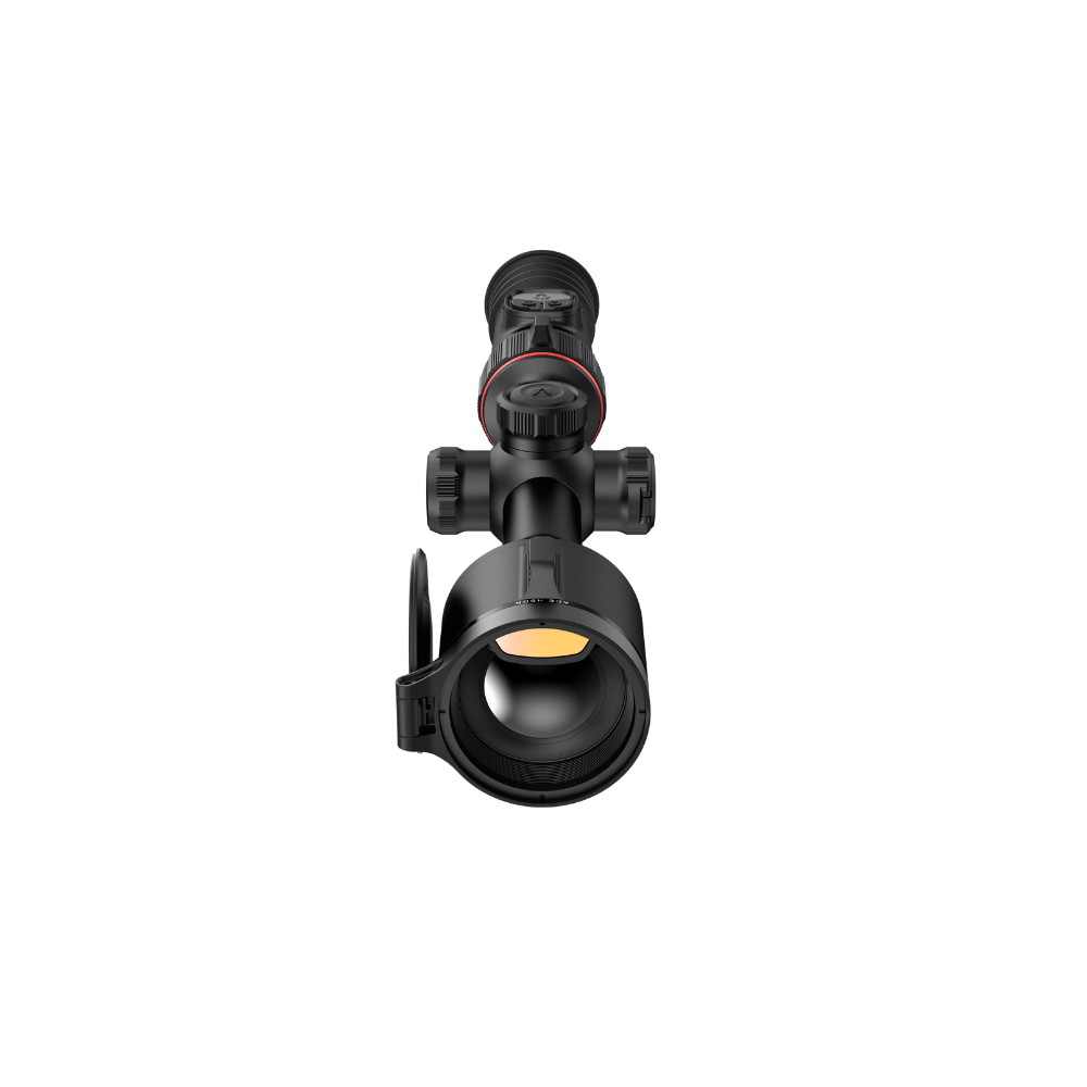 A black rifle scope with a flip-down protective lens cover attached to the front, shown.