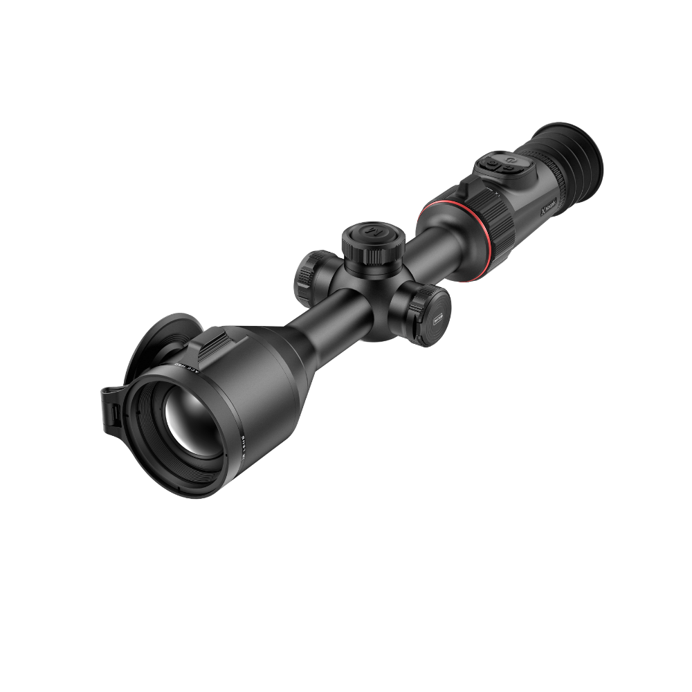 A black thermal scope rifle sight with a flip-down protective lens cover, shown at a diagonal angle.