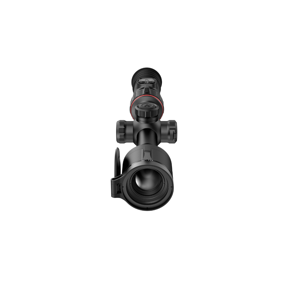 A black rifle scope with a red ring accent and a flip-down protective lens cover, shown from a top-down perspective.