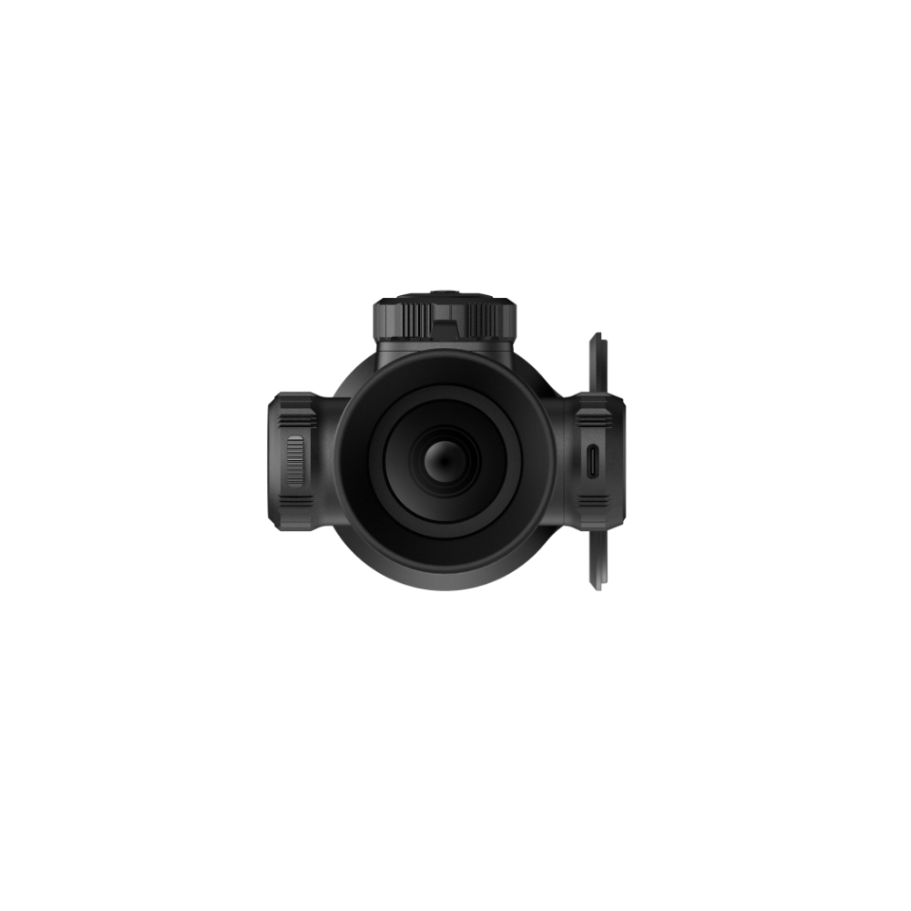 A black rifle scope with a hinged flip-up cover, shown from the front.