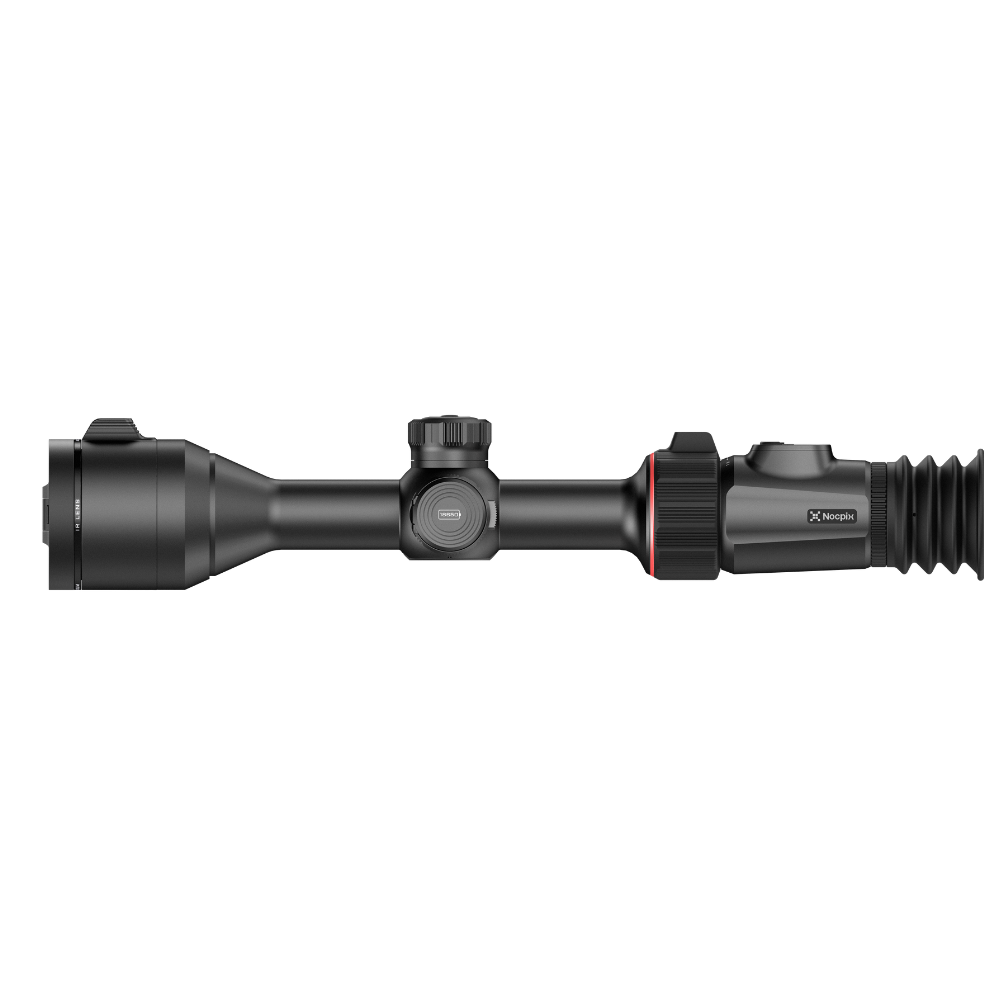 A black rifle scope with a hinged flip-up cover, shown from the side.