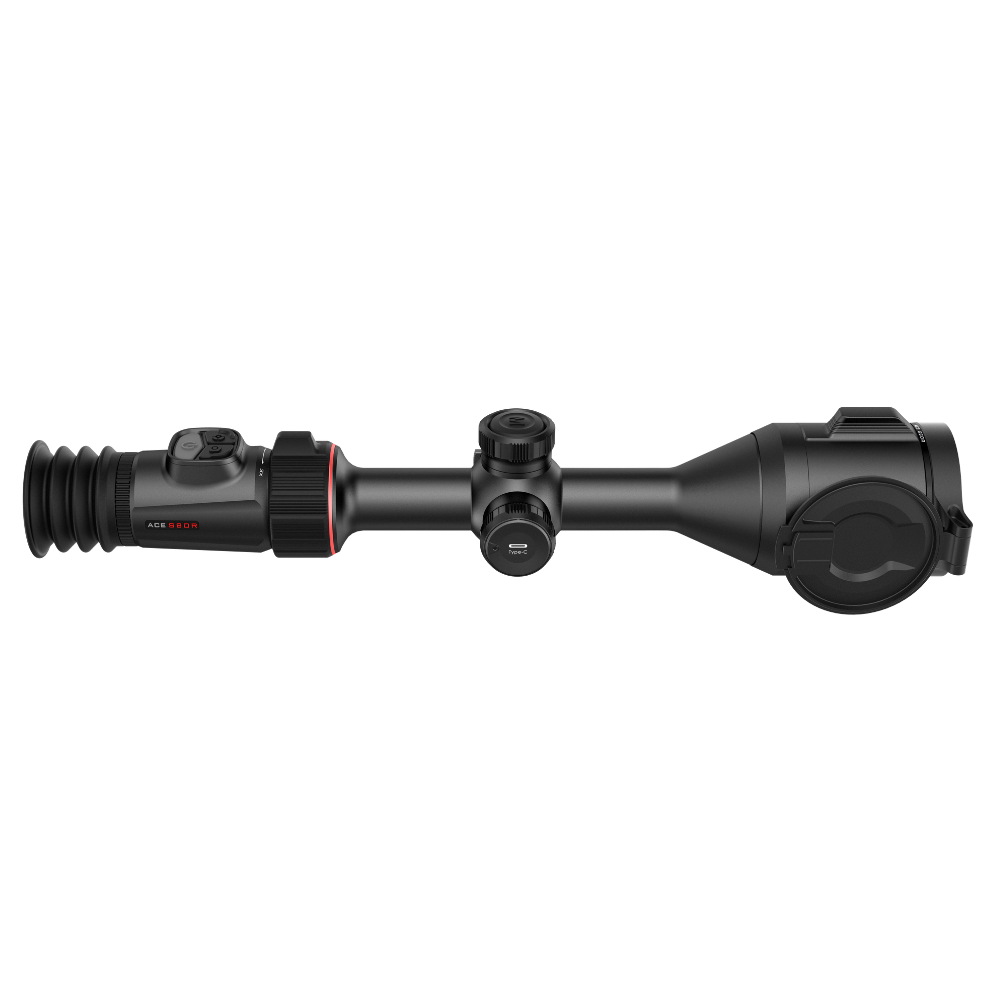 A black rifle scope with red accents, featuring a r a large objective lens on the right.