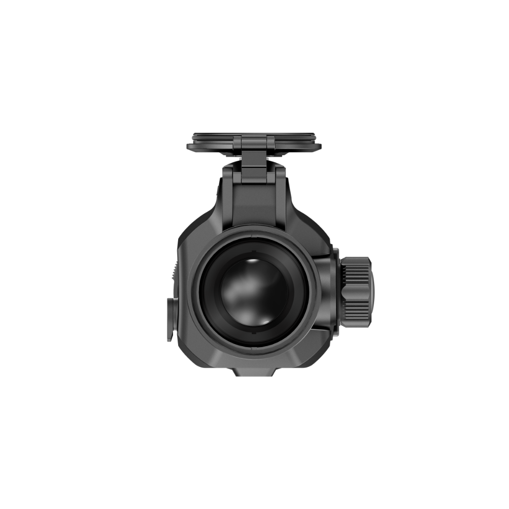 A black tactical clip-on with a top-mounted lens cap and a side adjustment dial, shown from a front-facing perspective.