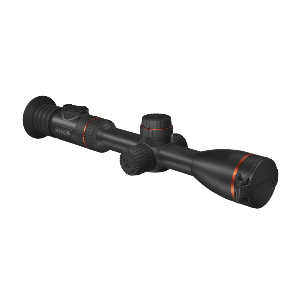 A black thermal imaging scope with red accent rings and a textured adjustment knob.