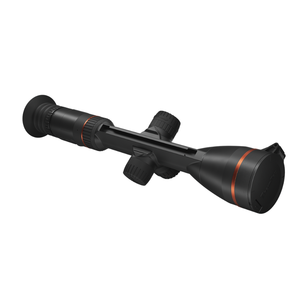 A black rifle scope with a large objective lens on one end, adjustment knobs along the body, and thin orange accent rings.