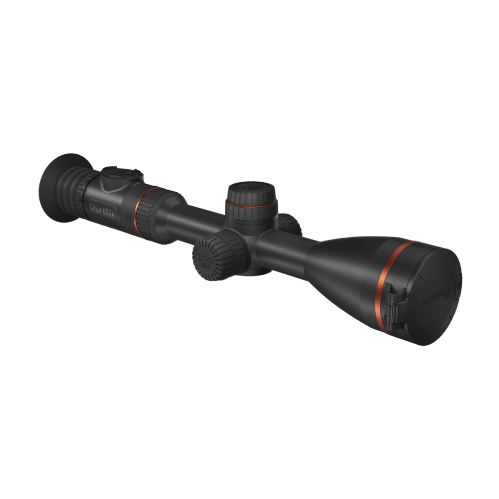 A black tactical rifle scope with red accent rings and a red logo, shown at a diagonal angle