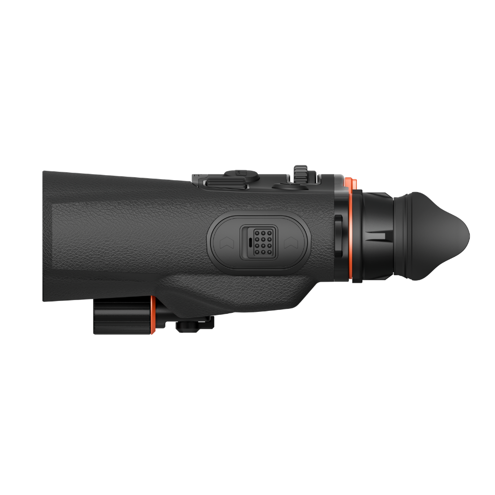 A side profile view of a black thermal binocular scope with orange accent rings.
